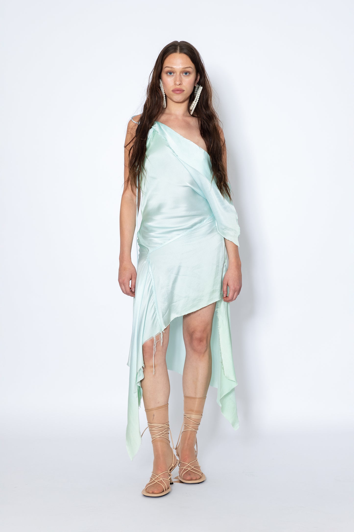 Model wears Silk asymmetric hem raw edge one-shoulder top Jade Cropper front view