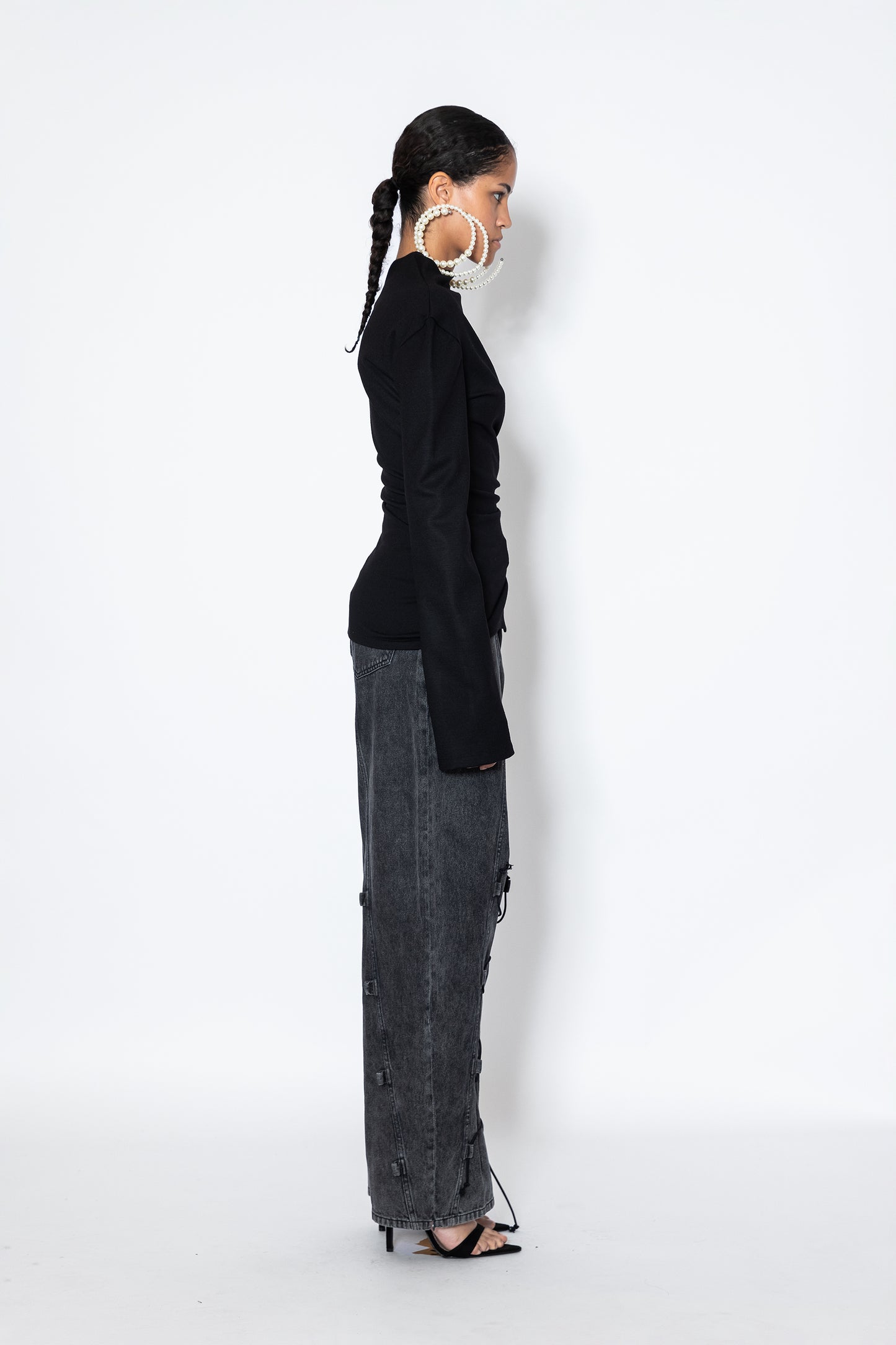 Jade Cropper Asymmetric Top With Slit in black side view highlights fitted silhouette long sleeves asymmetric cut and slit