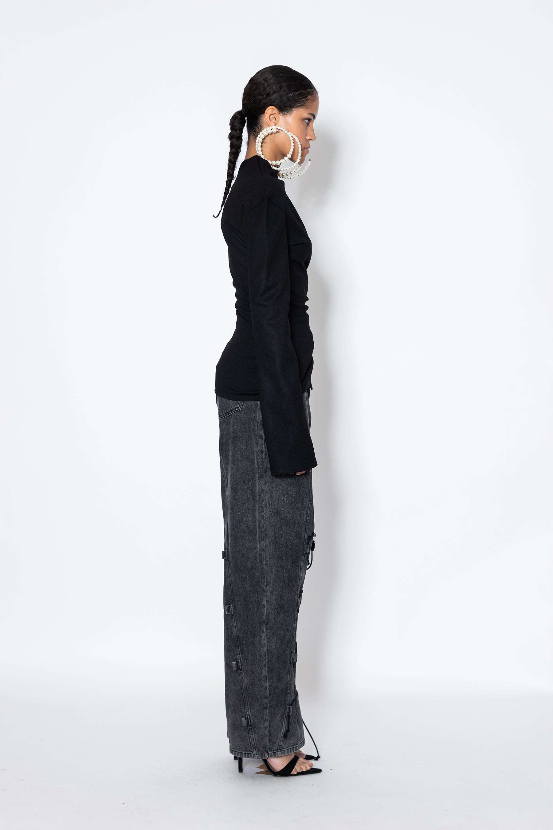 Jade Cropper Asymmetric Top With Slit in black side view highlights fitted silhouette long sleeves asymmetric cut and slit