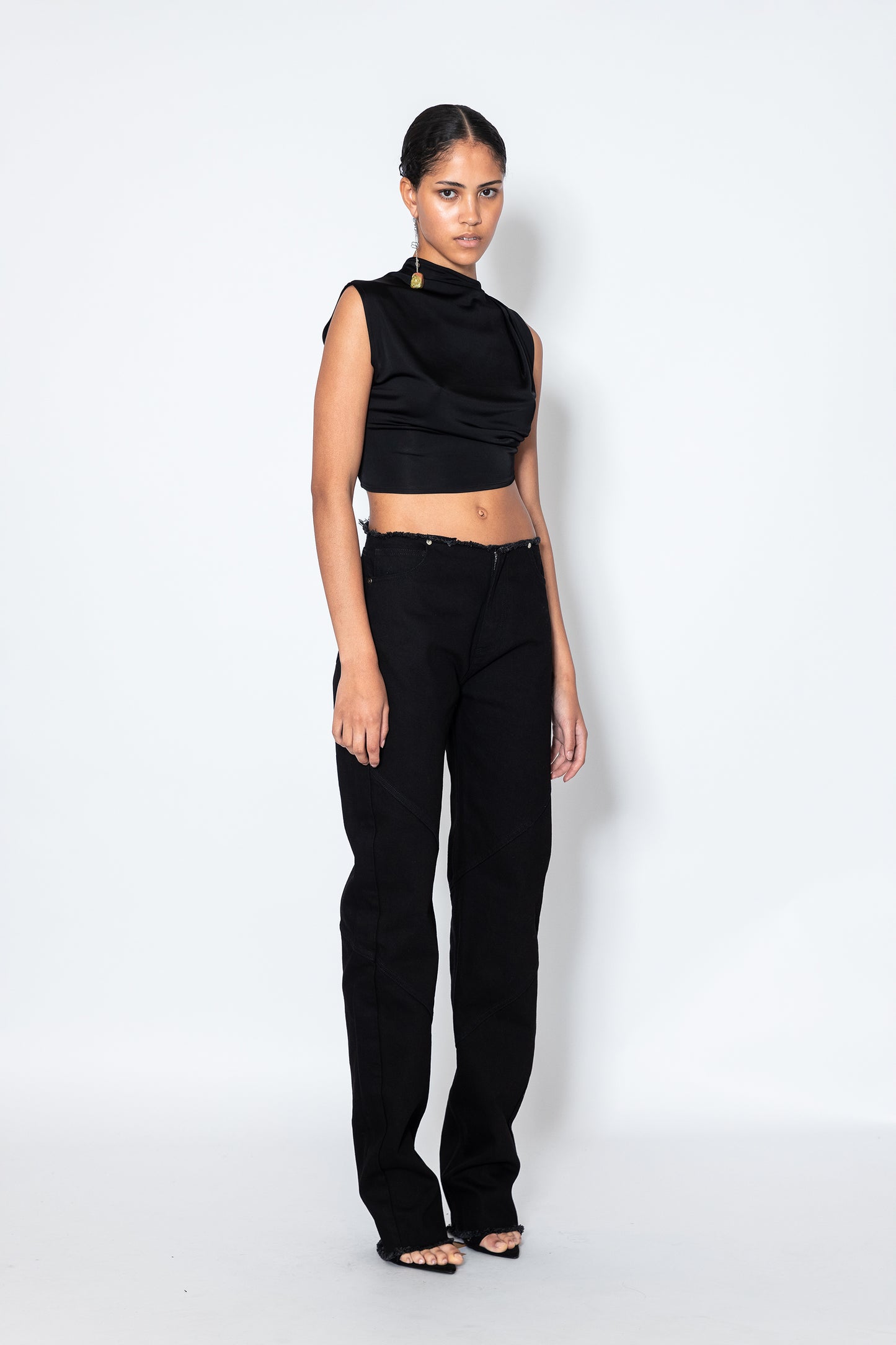 Jade Cropper Black Crop Top front view on model with raw edge, high waist, faded finish, and slim fit silhouette