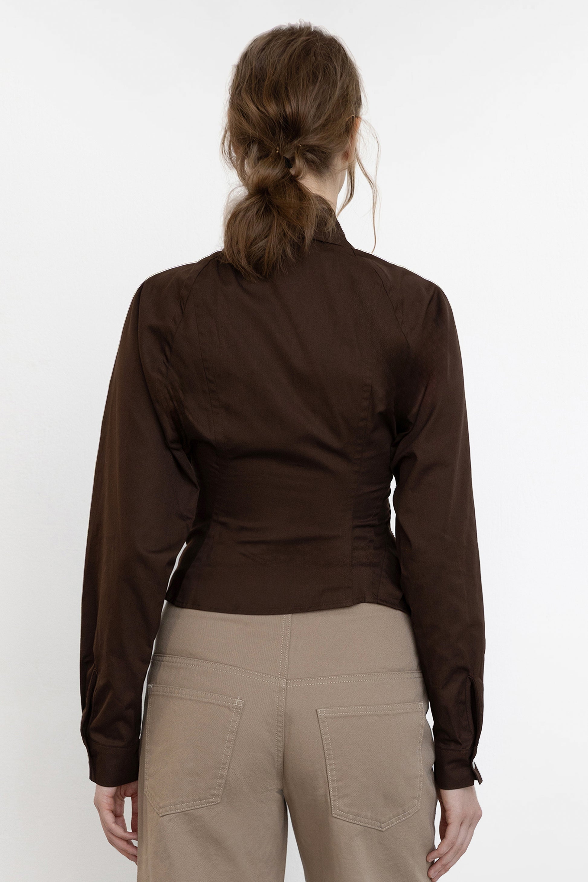 Jade Cropper asymmetric shirt brown back view fitted construction with asymmetric hem long sleeves and button detail