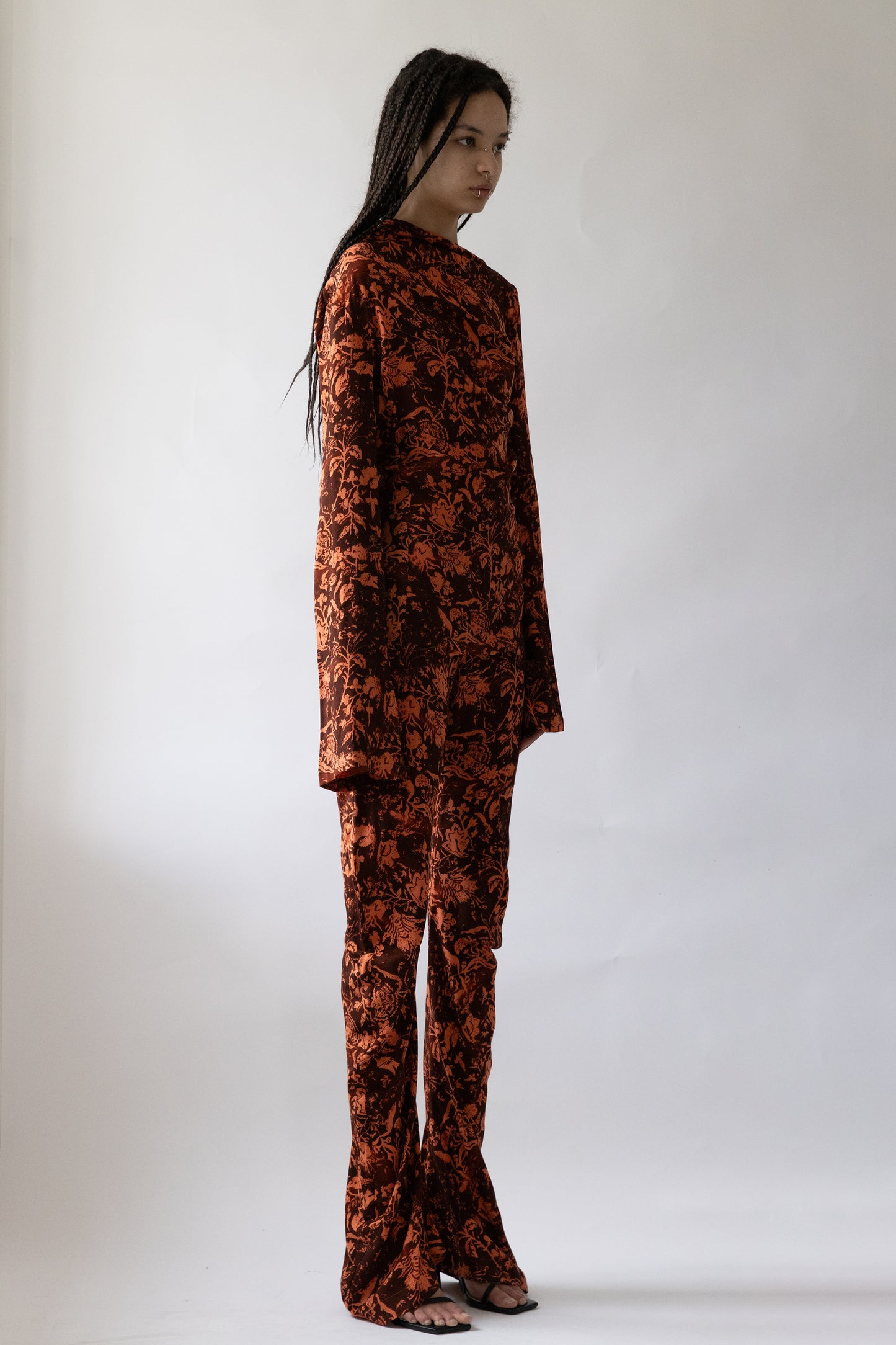 model in Jade Cropper floral pattern long sleeve wide leg soft fabric side view showing drape