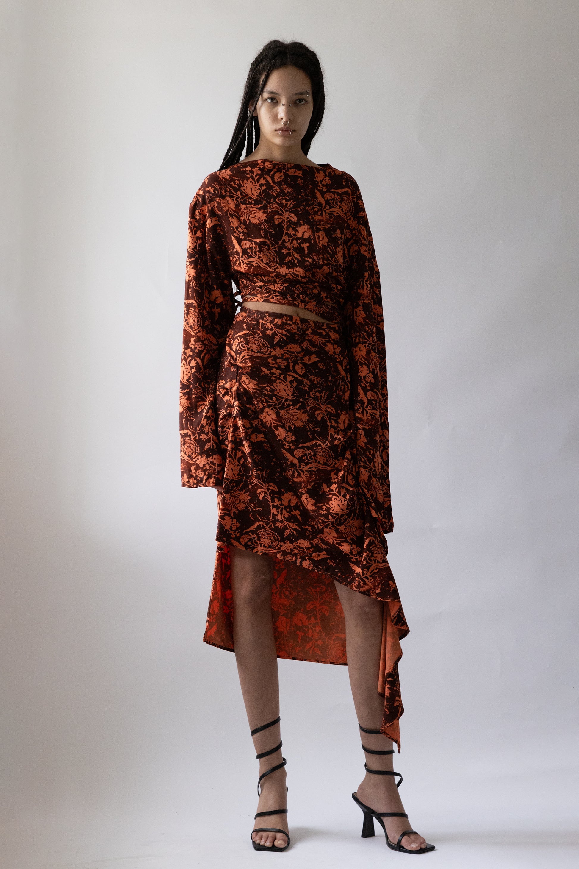 Jade Cropper product_name front view floral pattern asymmetric hem long sleeves slit detail on model