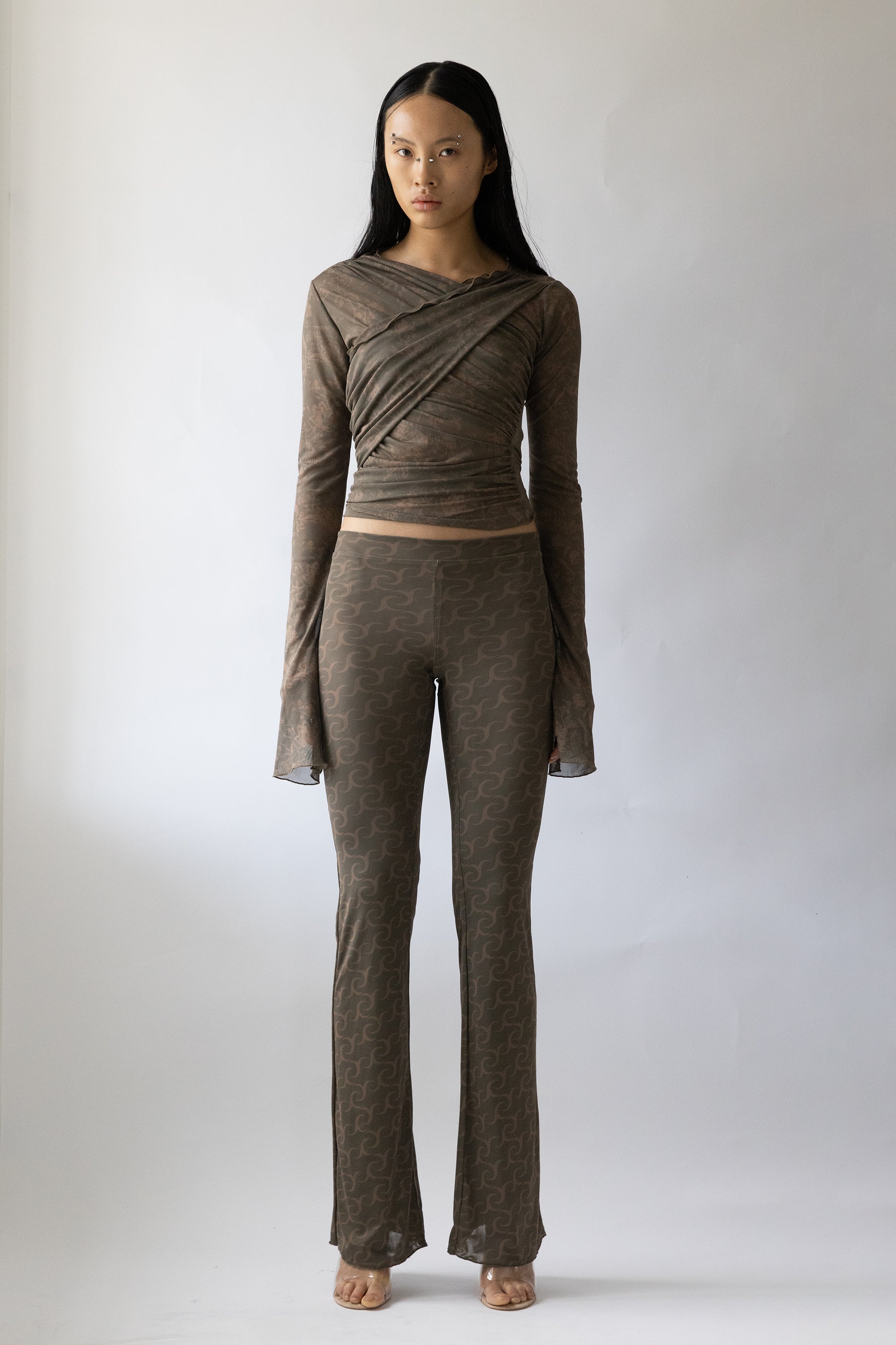 Jade Cropper wrap design sheer gray top with long sleeves front view on model