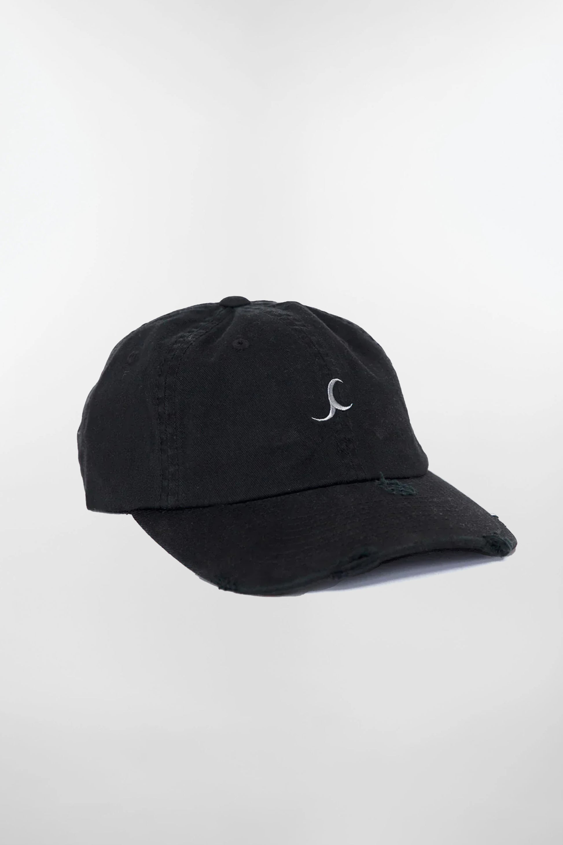 Jade Cropper Distressed logo cap in black cotton fabric with distressed hem and logo embroidery flat lay