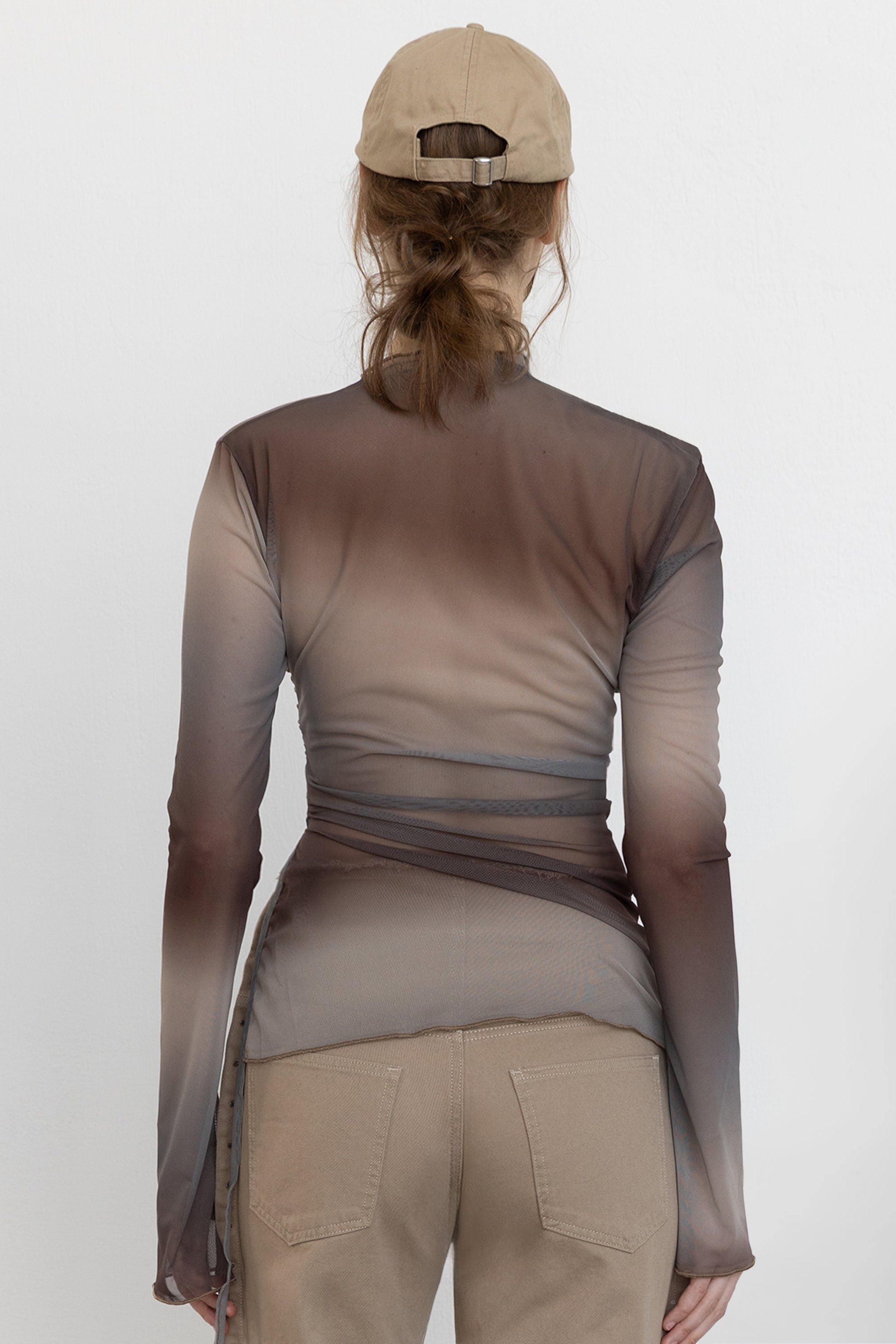 Back view of Jade Cropper Draped Top With Slit in gray with draped hem wrap design long sleeves sheer fabric