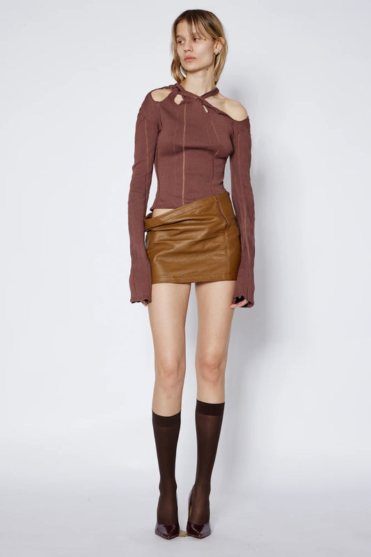 model wears Jade Cropper Braided Top in brown ribbed fabric with cut-out shoulders long sleeves front zip closure front view