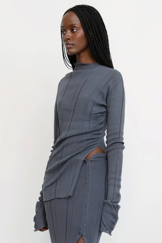 Jade Cropper Knitted Top With Slit in gray side view with ribbed texture, slit detail, long sleeves, and asymmetric hem